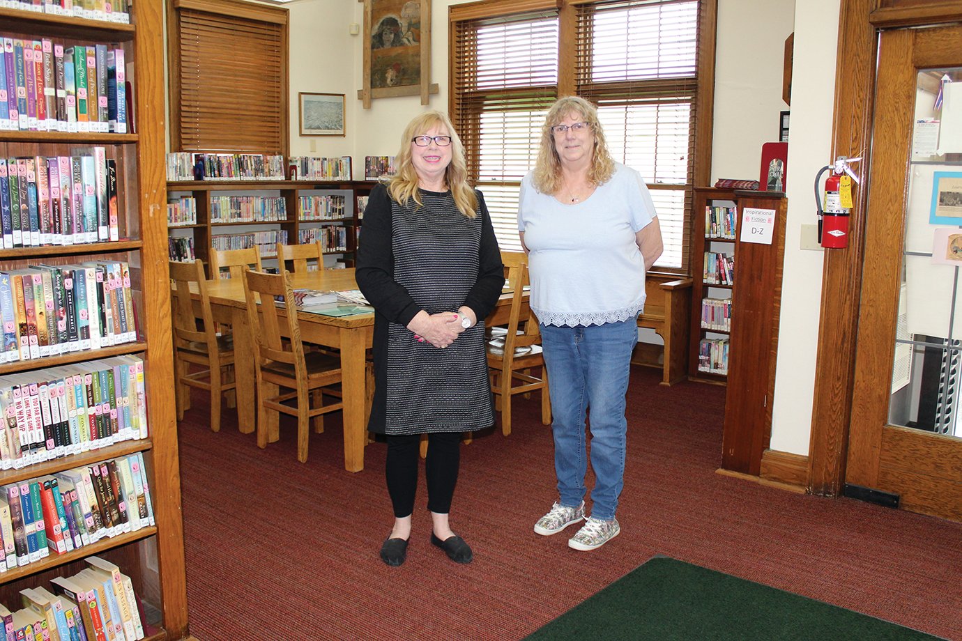 Linden Library Director Kathie Watkins, left, and Circulation Manager Alice McCloud invite the public to an open house Tuesday to celebrate the library.